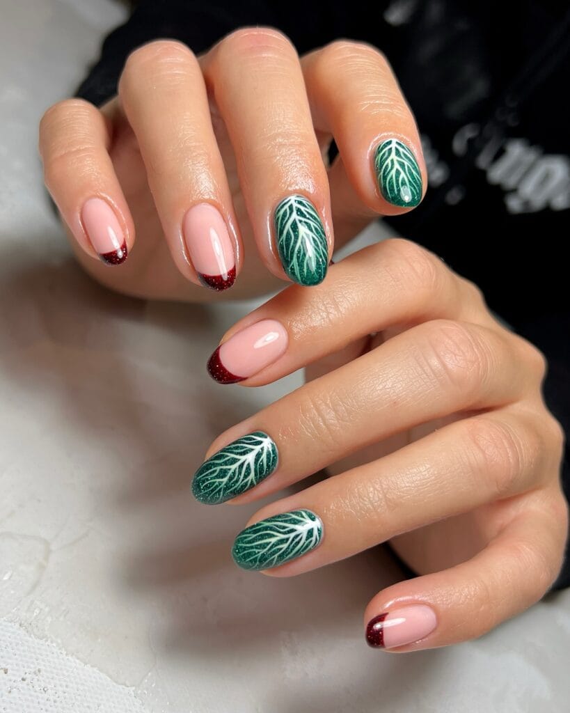 pink and red French nails with green holly leaf accent, Christmas holiday nails