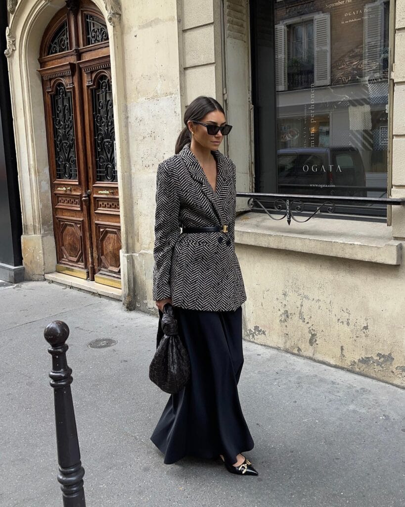 winter date outfit with herringbone blazer, black maxi skirt, sunglasses
