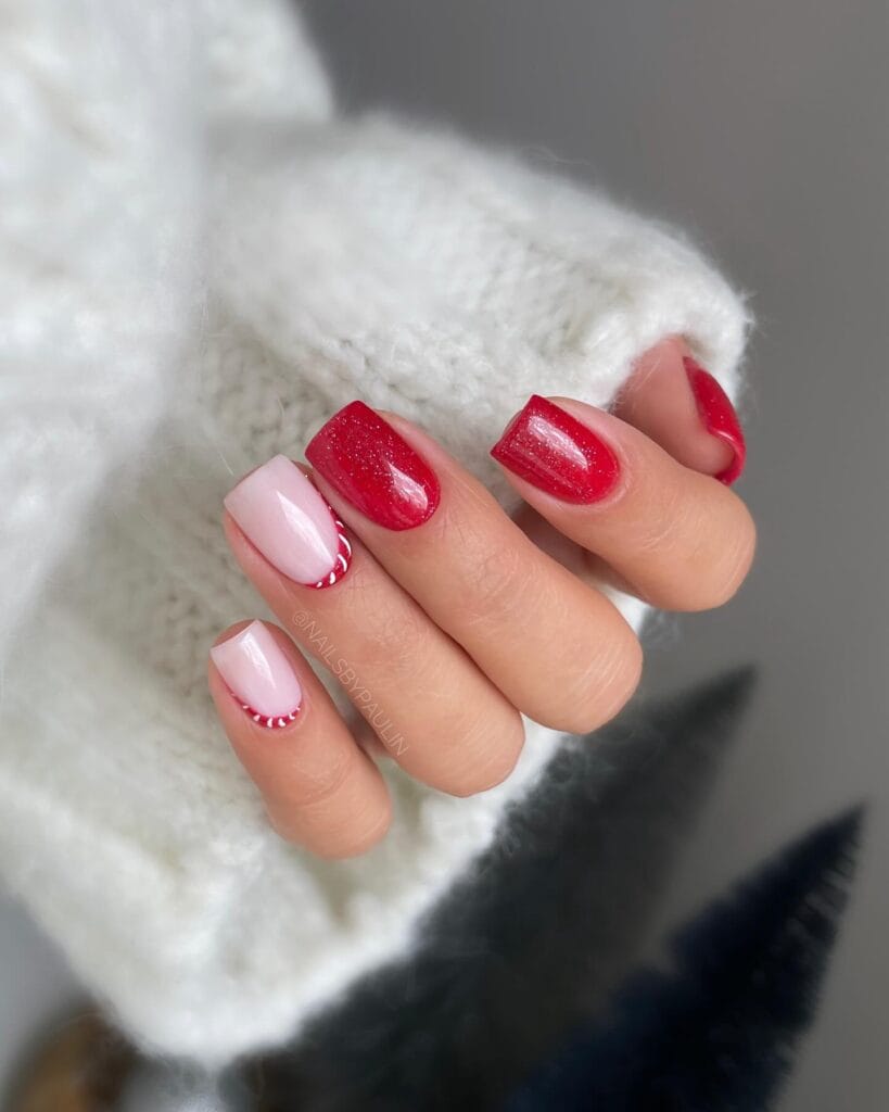 red glitter and pink nails with candy cane stripe detail, December nail ideas
