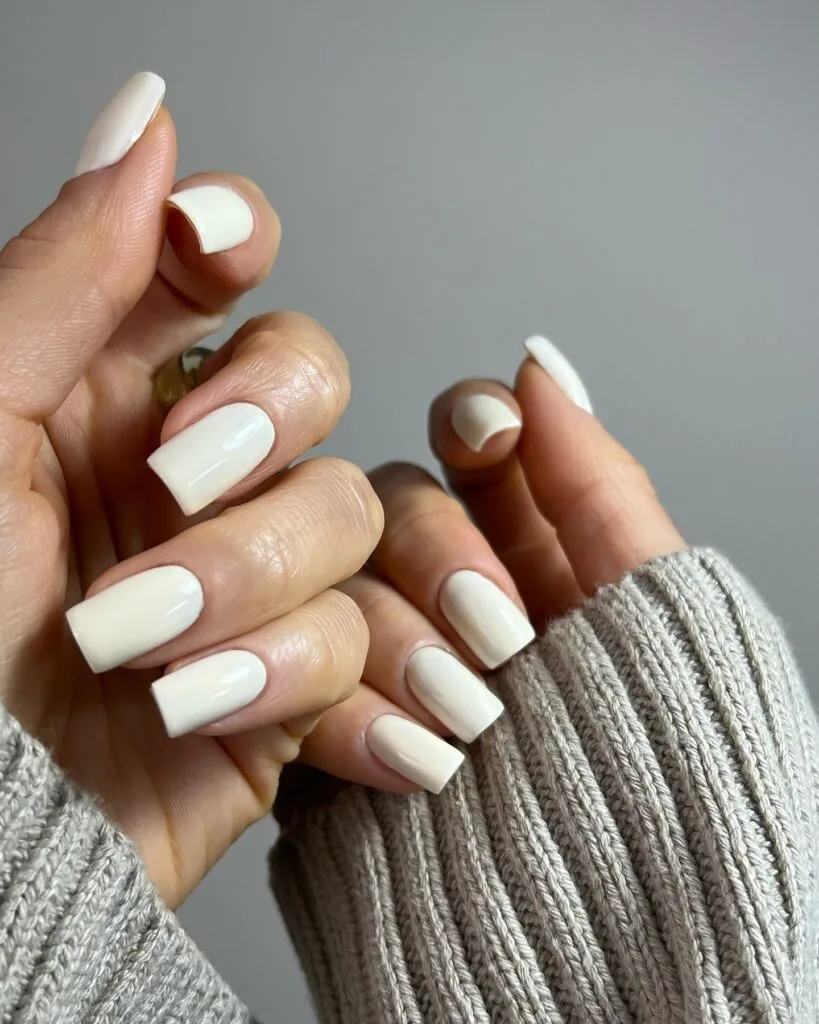 squared-off creamy off-white nails, simple winter old money manicure
