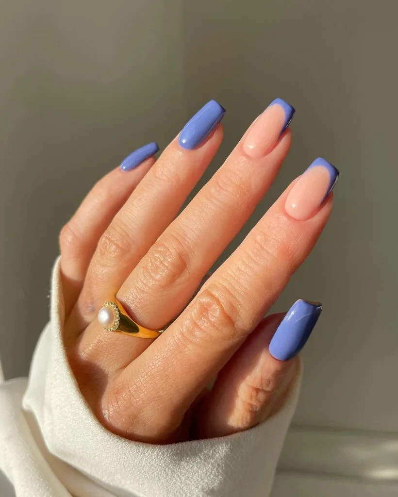 periwinkle blue manicure mixed with nude and blue French tips; simple winter nails.