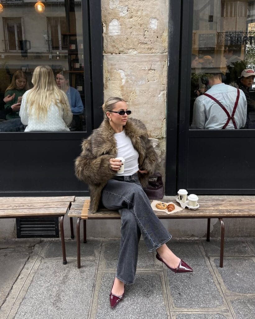 brown faux fur jacket, grey jeans, white tee, burgundy heels, winter paris winter outfit
