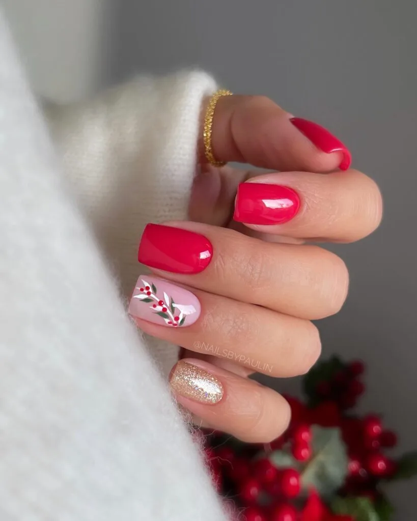 short red and gold nails with pink accent and red berry branch art, Christmas nails