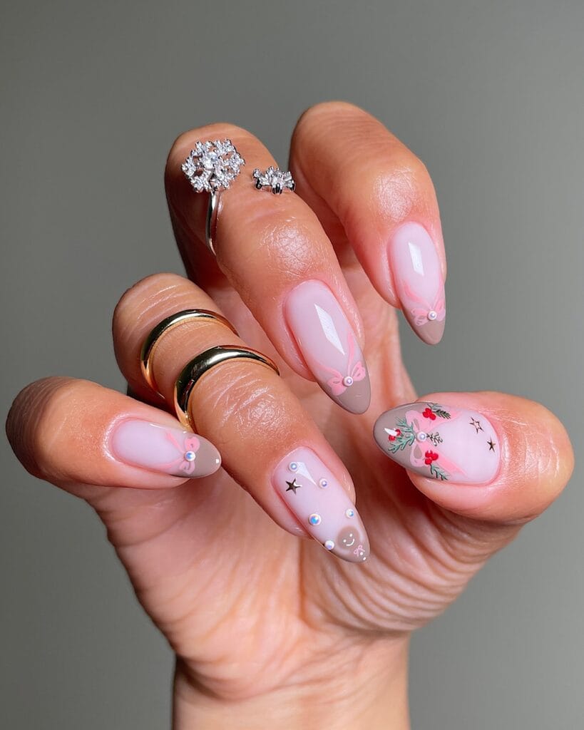pink and taupe nails with 3D rhinestones, bows, holly, and star accents, December nail ideas
