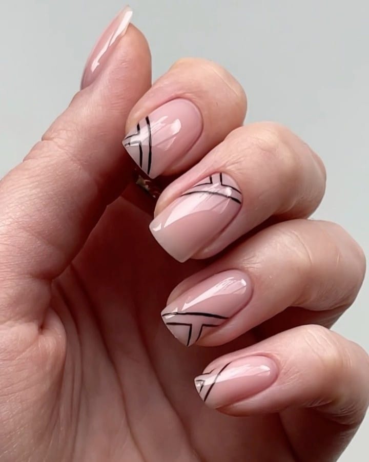winter nail trends with nude nails and black geometric lines