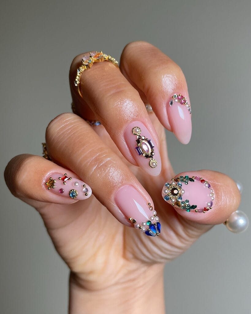 rhinestone winter nails with multicolored gems on a nude base