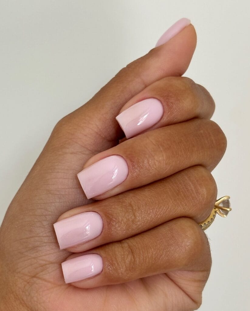 light pink square winter nails with glossy finish