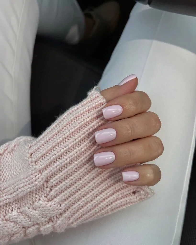 glossy soft pink nails with cozy knit sweater, simple winter old money manicure
