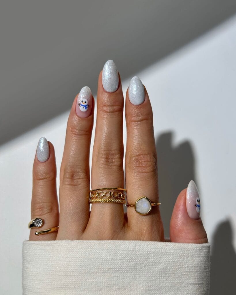 sparkly white nails with tiny snowman art, glitter Christmas winter nails