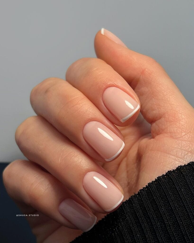 short pink nails with micro white french tips, classic winter old money nails
