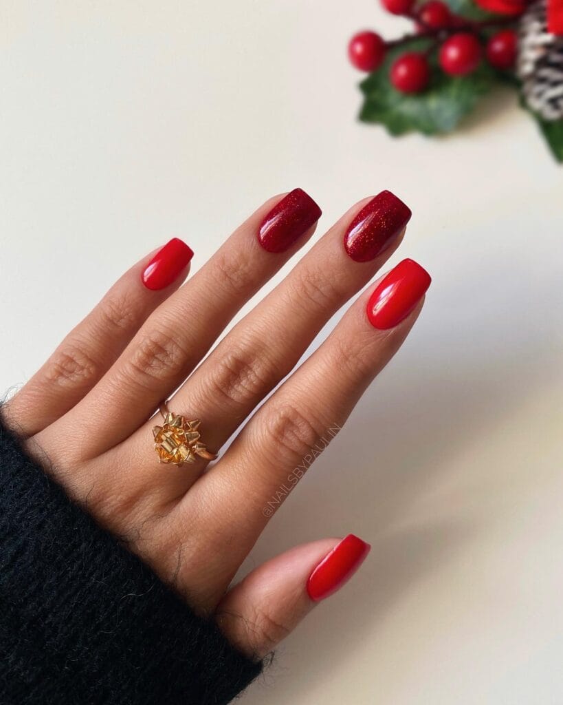 classic red nails with red glitter accent, December nail ideas
