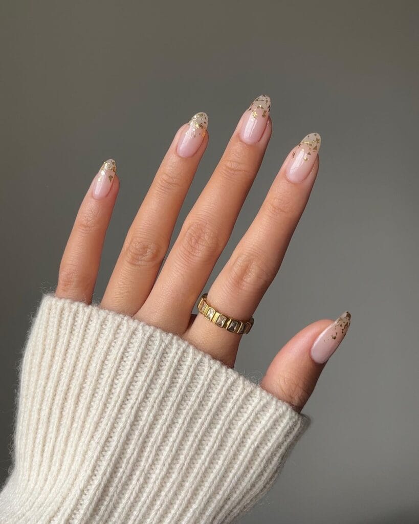 gold foil French tips on sheer pink nails, December nail ideas
