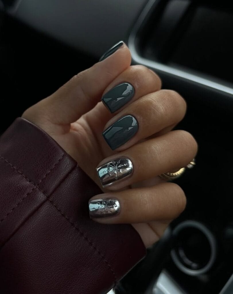 Glossy dark gray nails with metallic silver accent art" winter nail trends, gray manicure