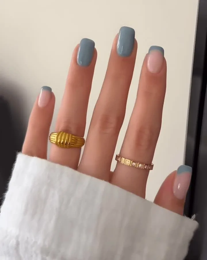 nail colors for 2026, short square nails in muted blue and sheer pink with gold rings