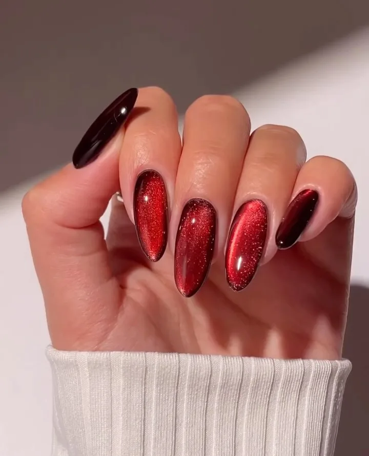 2026 nail trends, red glass nails with glitter shimmer and glossy finish