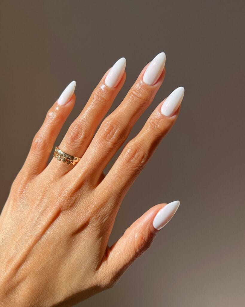 2026 nail trends, cloud white almond nails with soft milky finish and gold rings