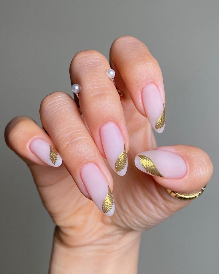2026 nail trends, soft pink nails with gold foil accents and silver pearl rings