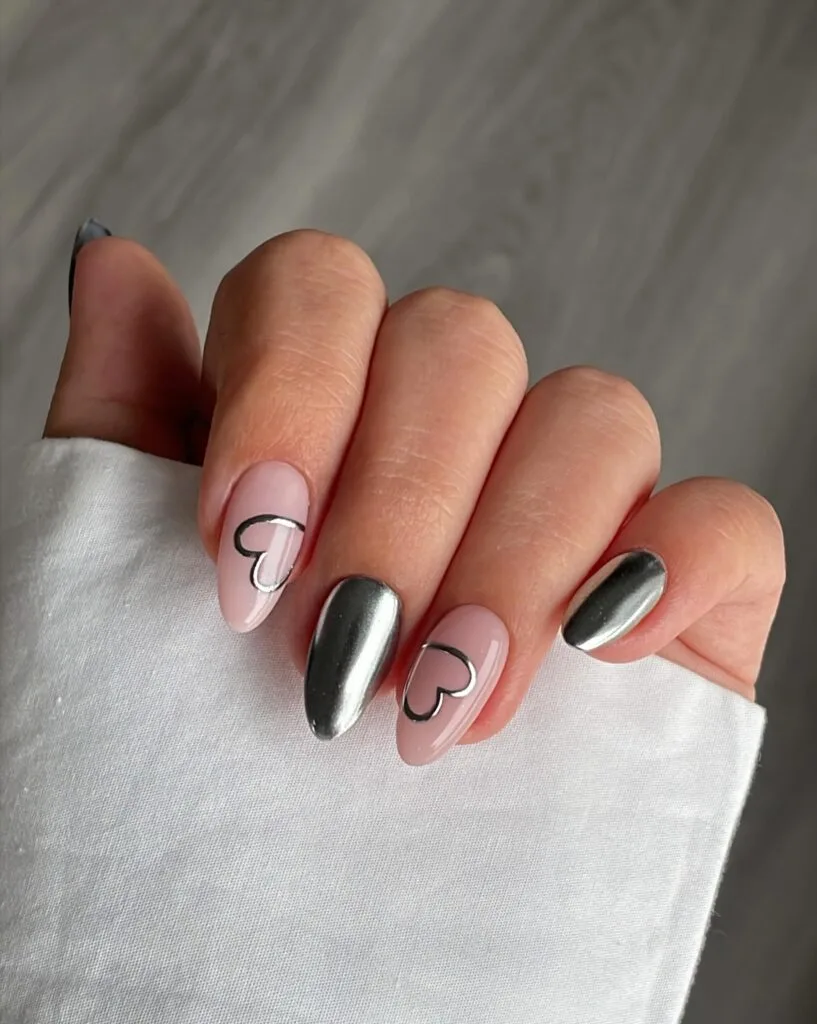 2026 nail trends, pink nails with silver chrome accent nails and heart outlines