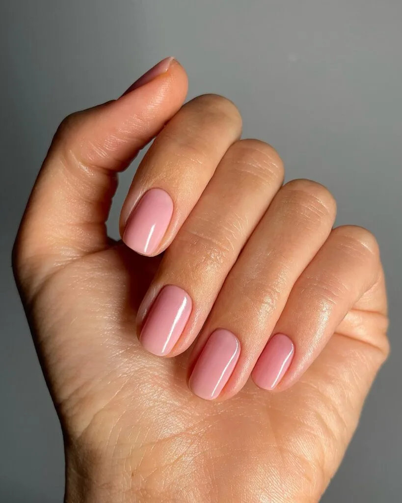 2026 nail trends, babydoll jelly pink short nails with glossy sheer finish