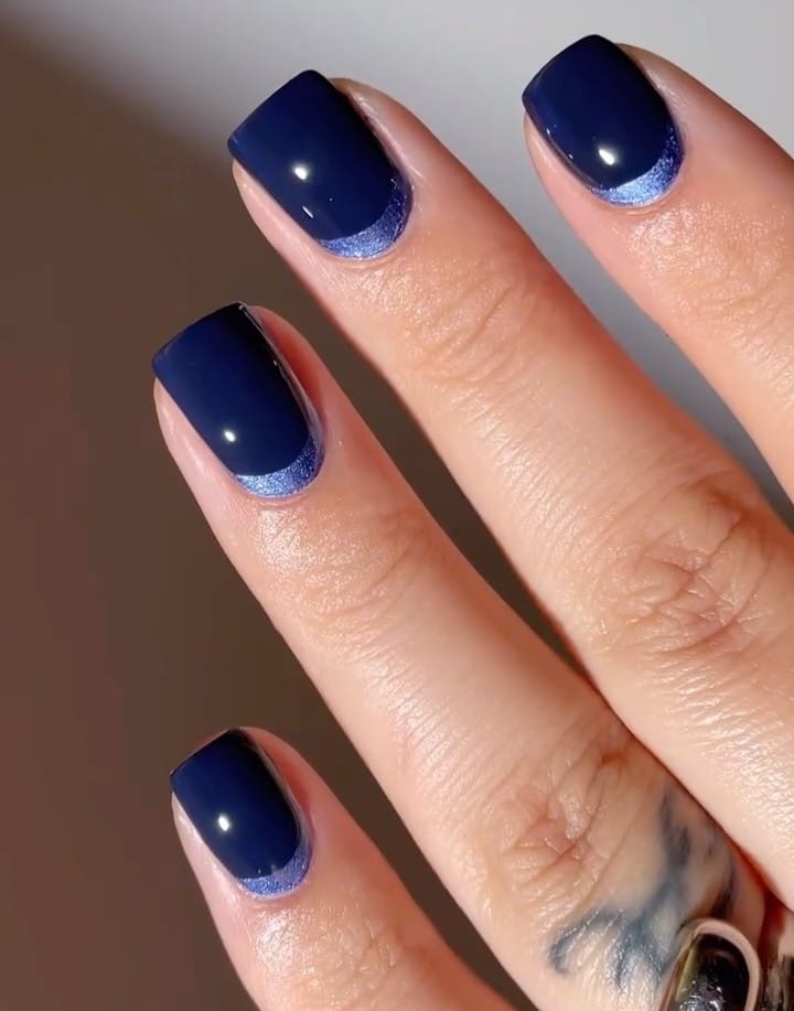 ocean blue short square nails with glossy finish and shimmer detail, silver ring