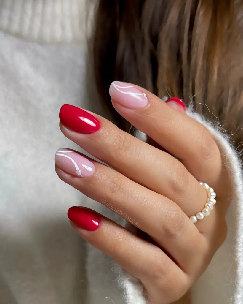 2026 nail trends, oval nails with pink swirl details and red accent nails
