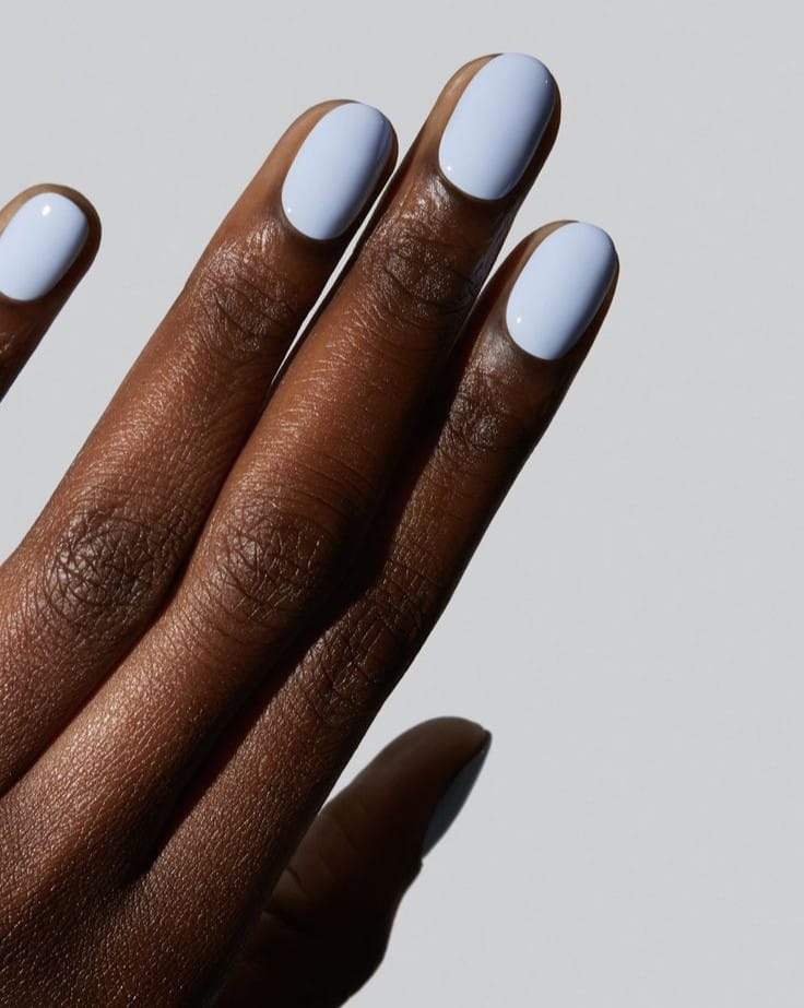 spring nail colors 2026, pale sky blue short round nails, glossy finish