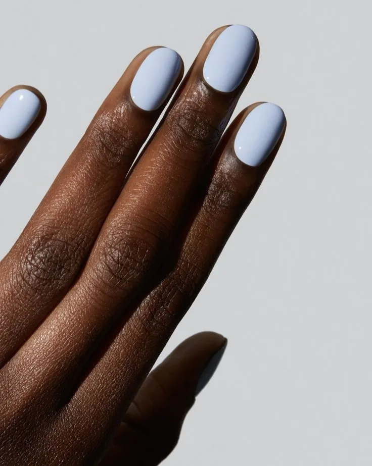 spring nail colors 2026, pale sky blue short round nails, glossy finish