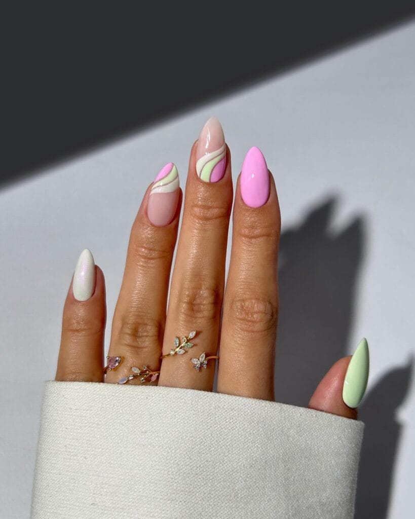 classy spring nails, almond pastel pink green and white nails with abstract swirl art on nude base