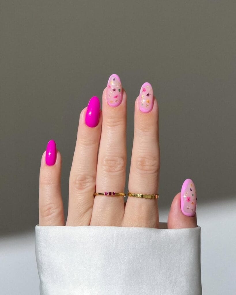 classy spring nails, almond hot pink fuchsia nails with sheer pink confetti flower and metallic accent nails