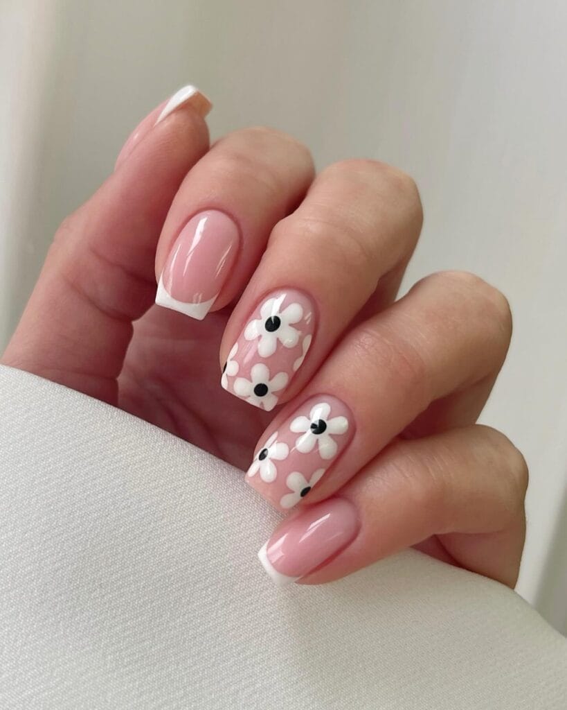 classy spring nails, short square pink nails with white French tips and large white daisy flower art