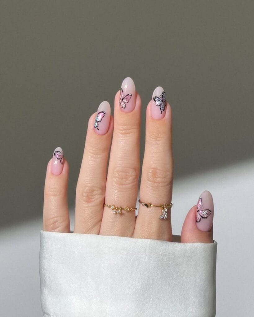 classy spring nails, almond nude pink nails with detailed hand-painted watercolor butterfly art