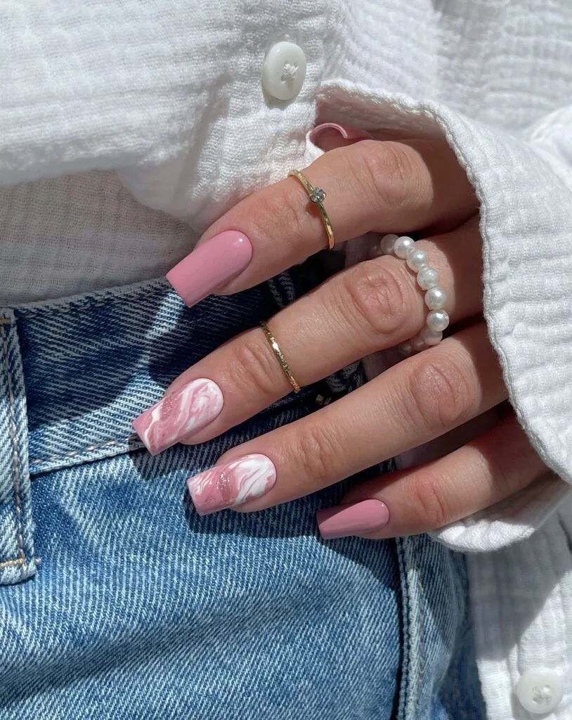 spring nail trends 2026, pink and white marble swirl square nails with glitter accent