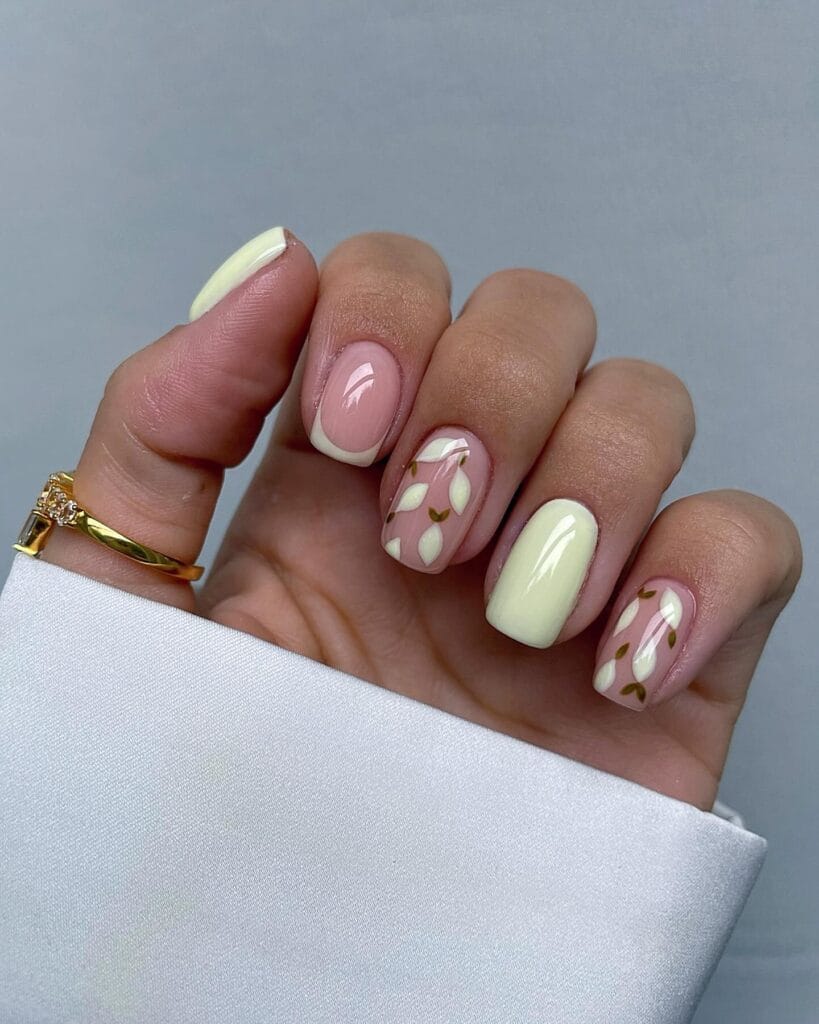 classy spring nails, short square butter yellow nails with white tulip floral art on pink base
