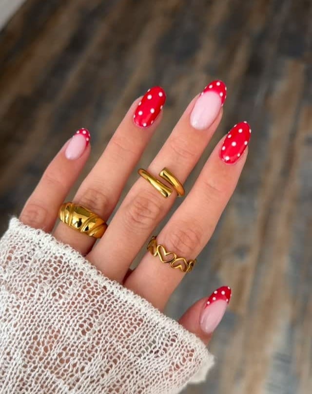 spring nail trends 2026, red and white polka dot almond nails with pink base