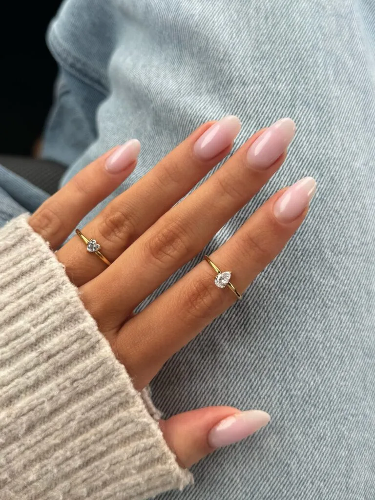 spring nail trends 2026, milky white almond nails with soft pink undertone, glossy finish