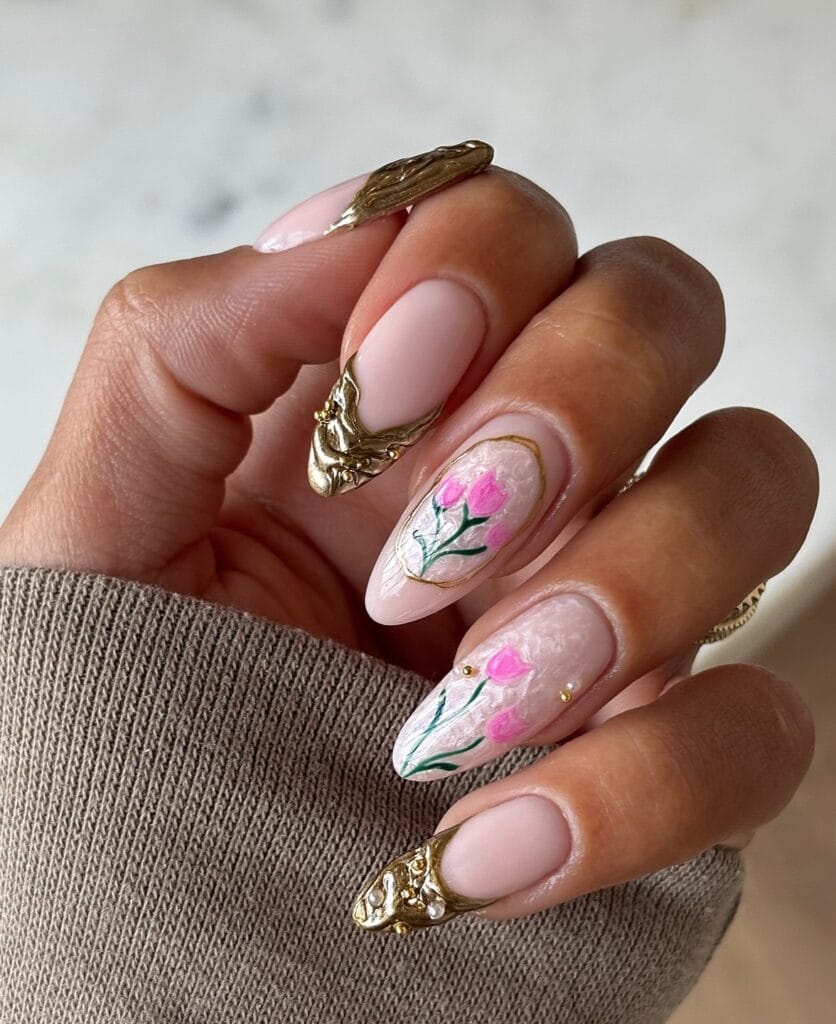 spring nail trends 2026, pink almond nails with hand-painted tulips and gold metallic accents