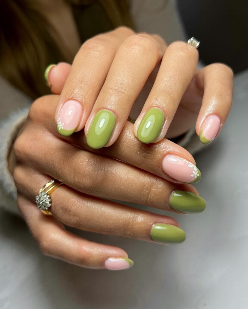 classy spring nails, short oval sage green nails with green French tips and white daisy accents