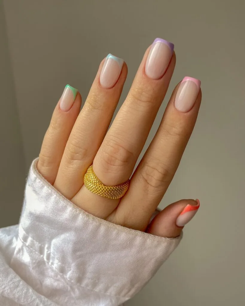 spring nail trends 2026, short square nails with rainbow pastel French tips on nude base