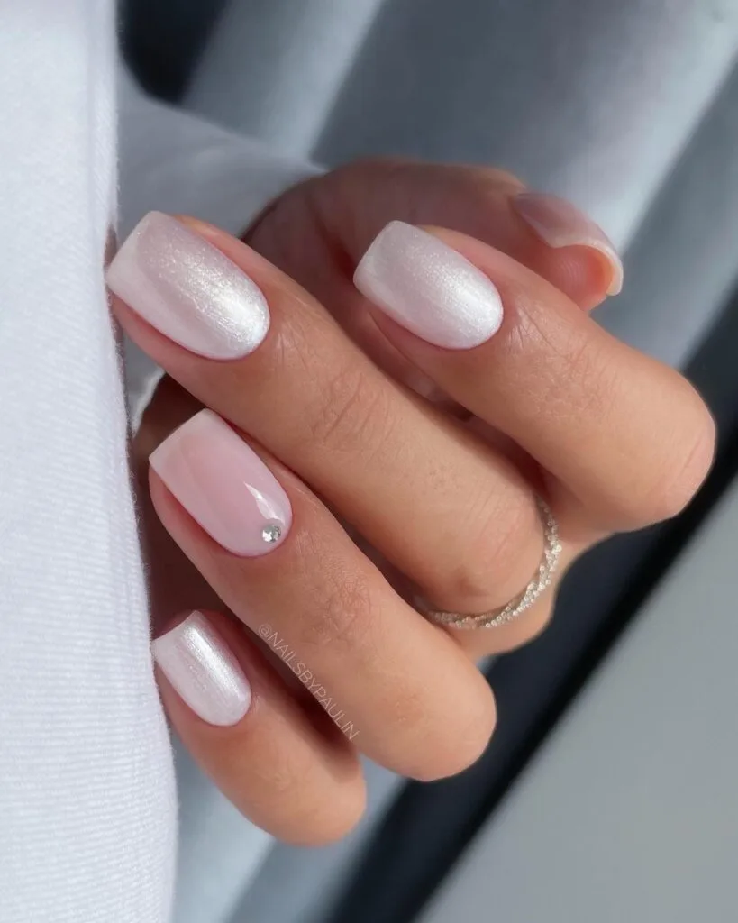 spring nail trends 2026, white opalescent short square nails with tiny gem accent
