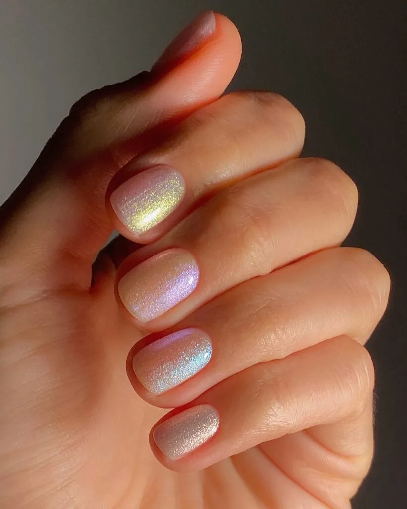 spring nail trends 2026, iridescent opalescent short round nails with rainbow color shift