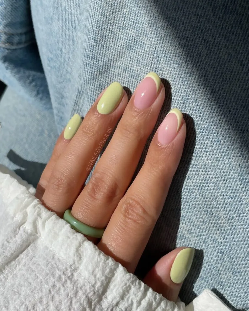 simple spring nails, short square pistachio green and pink nails with thin green outline accents

