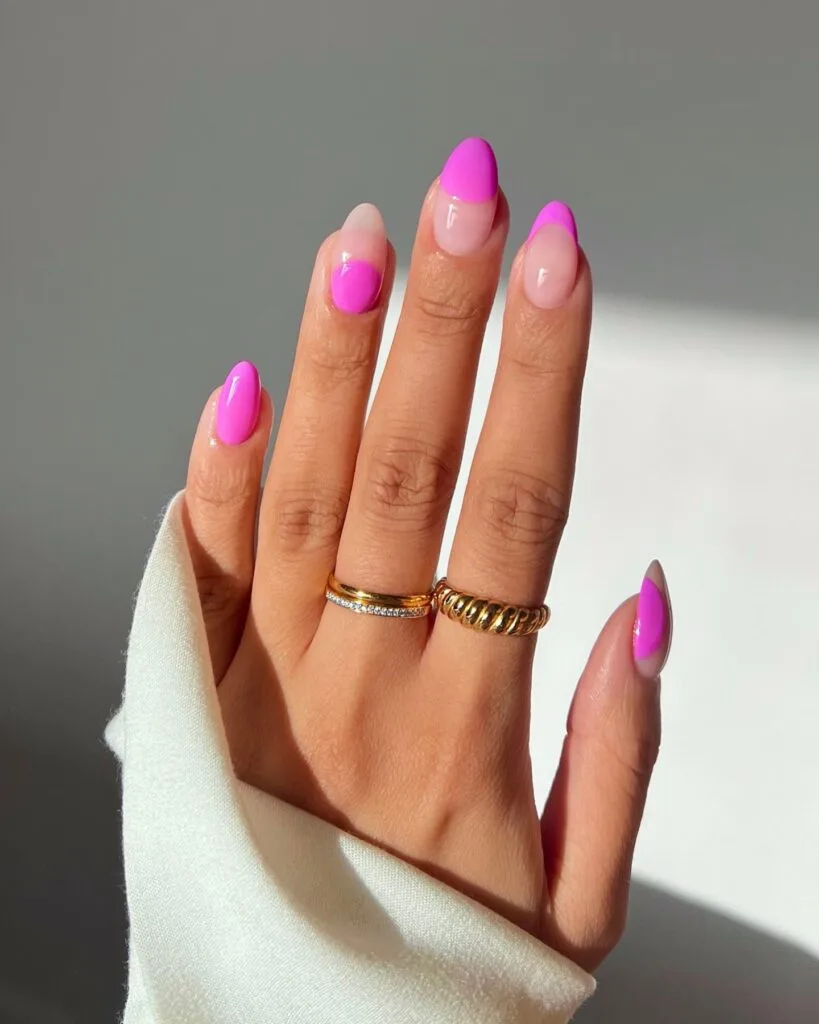 simple spring nails, almond hot pink solid nail with sheer pink nails and abstract pink blob accents
