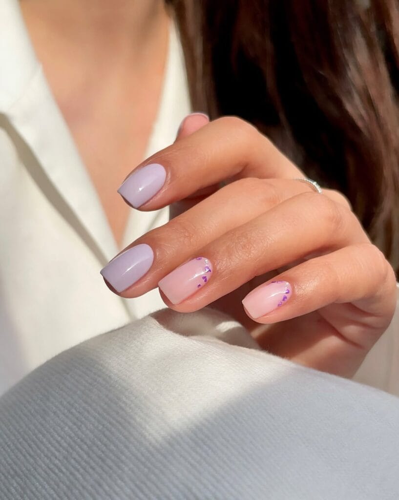 simple spring nails, short square lavender and sheer pink nails with tiny purple heart glitter accents