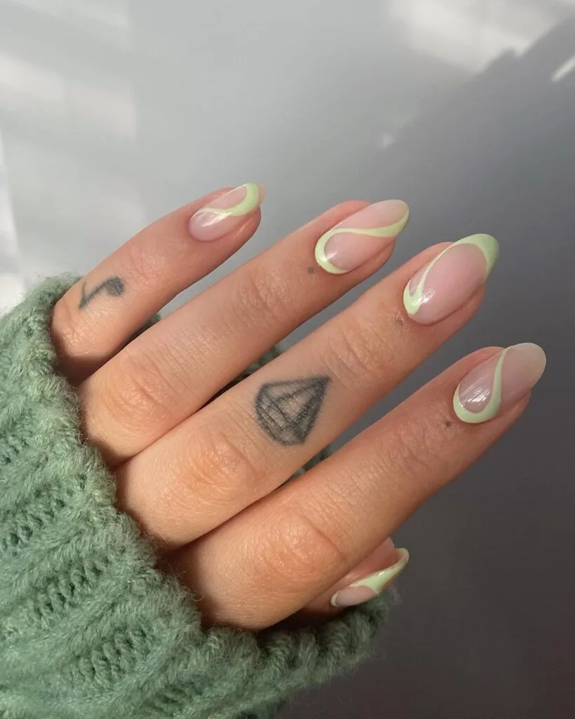 may nail colors, pistachio green swirl design on nude almond nails