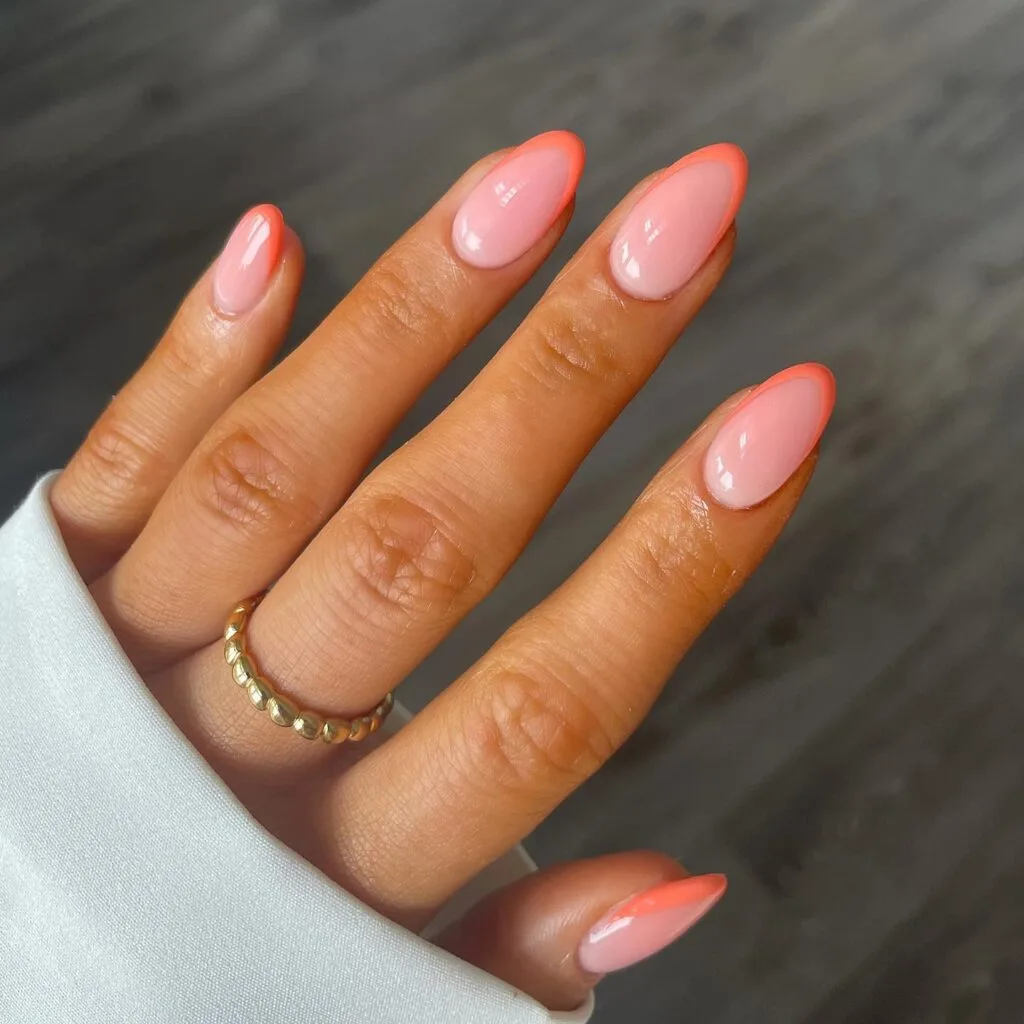 simple spring nails, almond sheer pink nails with coral peach French tips
