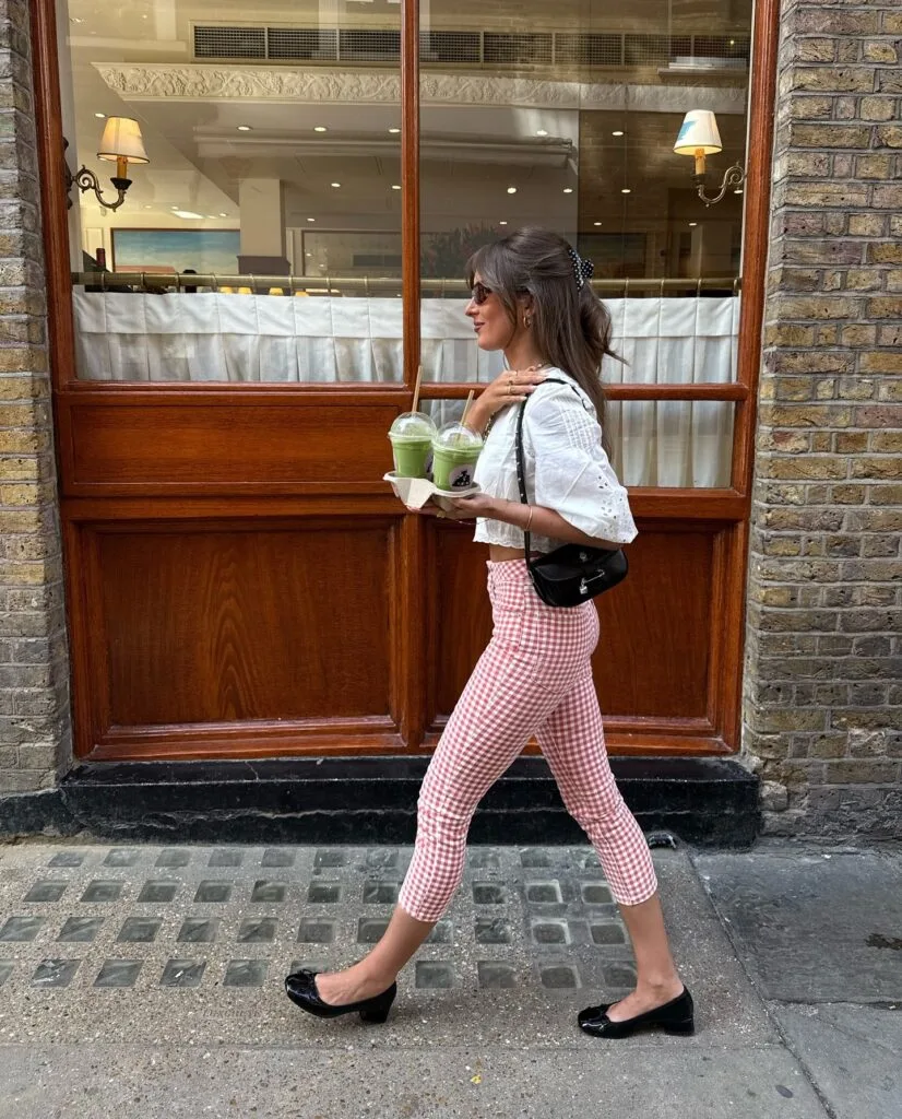 spring fashion trends 2026, pink gingham capri pants with white eyelet blouse and black flats