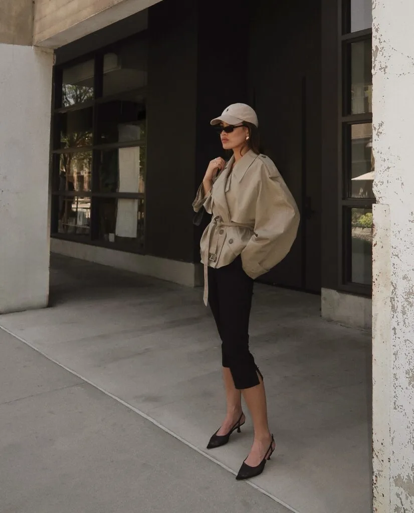 spring fashion trends 2026, black cropped capri pants with beige belted trench jacket and kitten heels