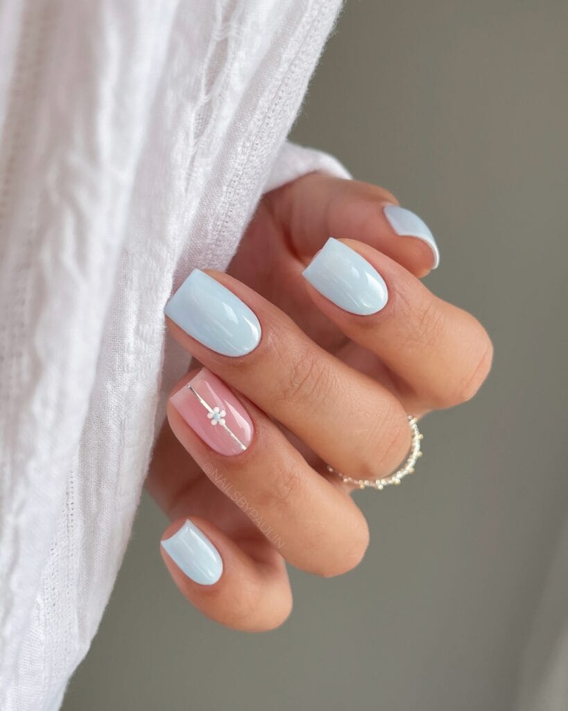 simple spring nails, short square baby blue nails with white French tips and sheer pink daisy accent nail
