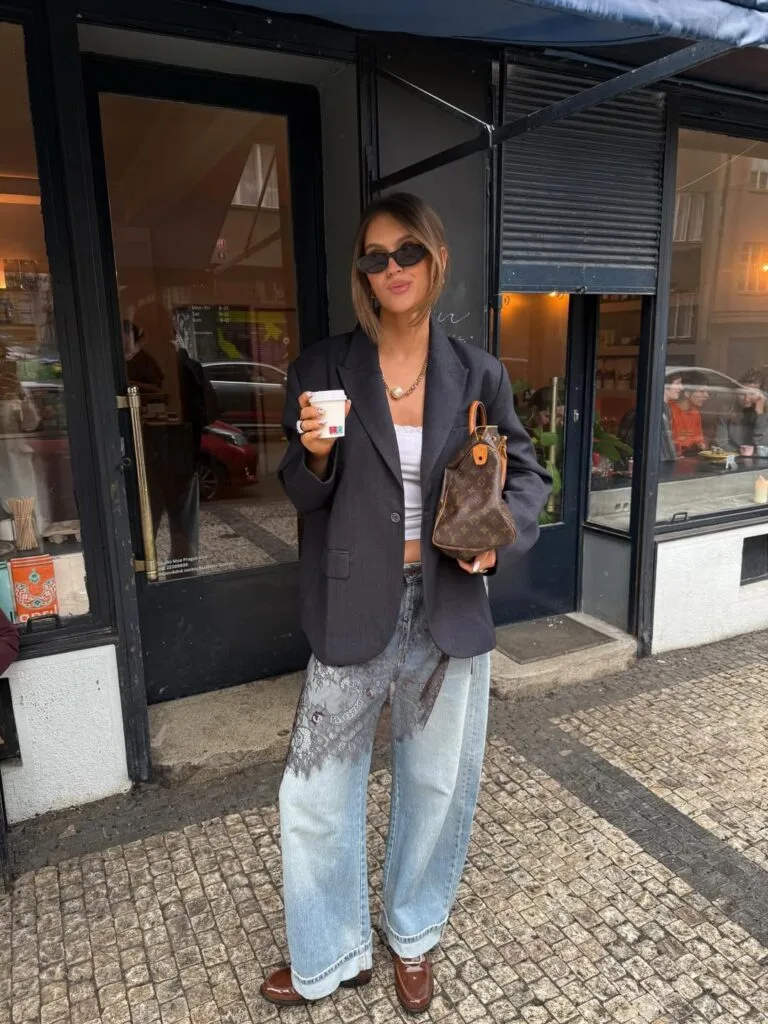 may outfit with dark oversized blazer, white lace trim top, light wash lace panel jeans, and brown loafers
