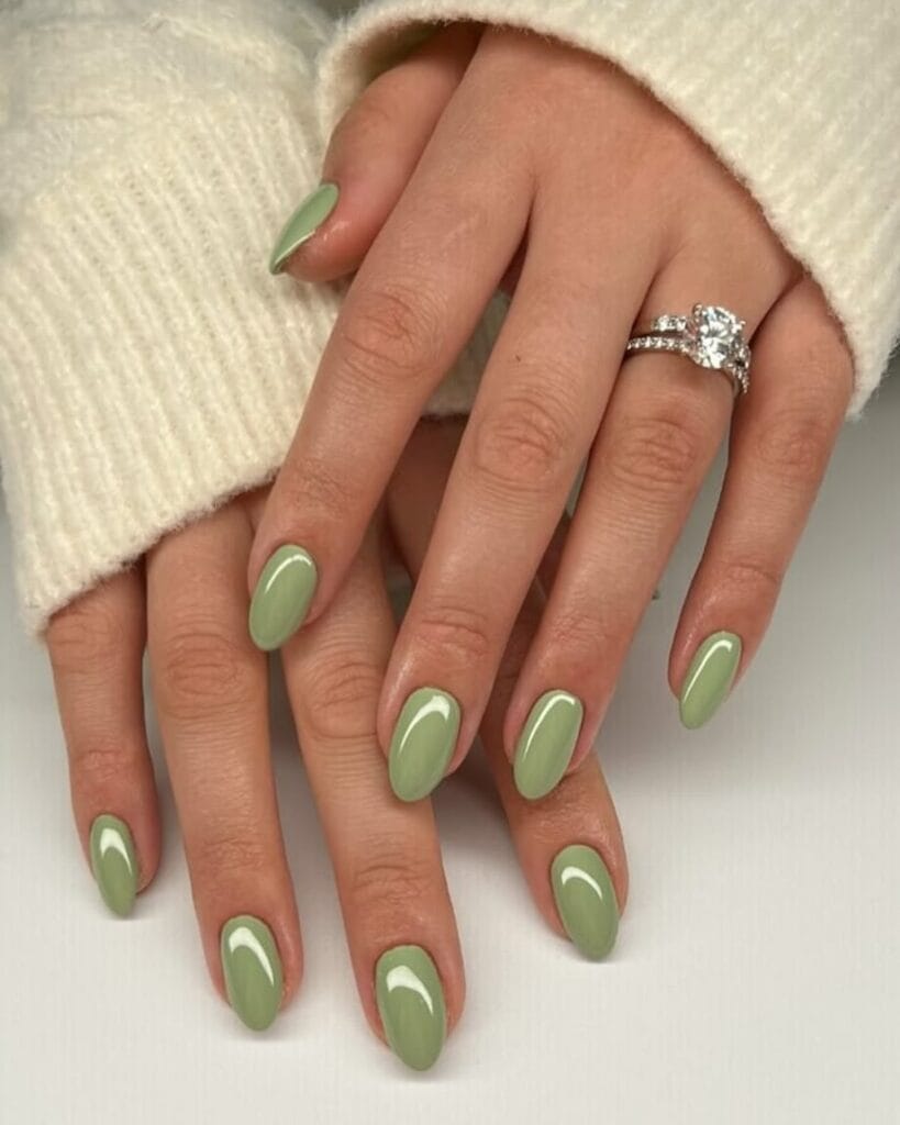summer nail colors, jade green glossy almond nails with diamond ring